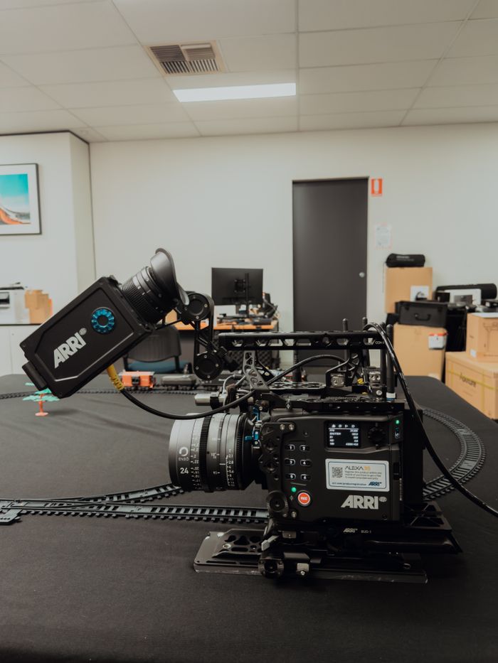 A detailed view of a professional ARRI film camera setup in an indoor studio setting.